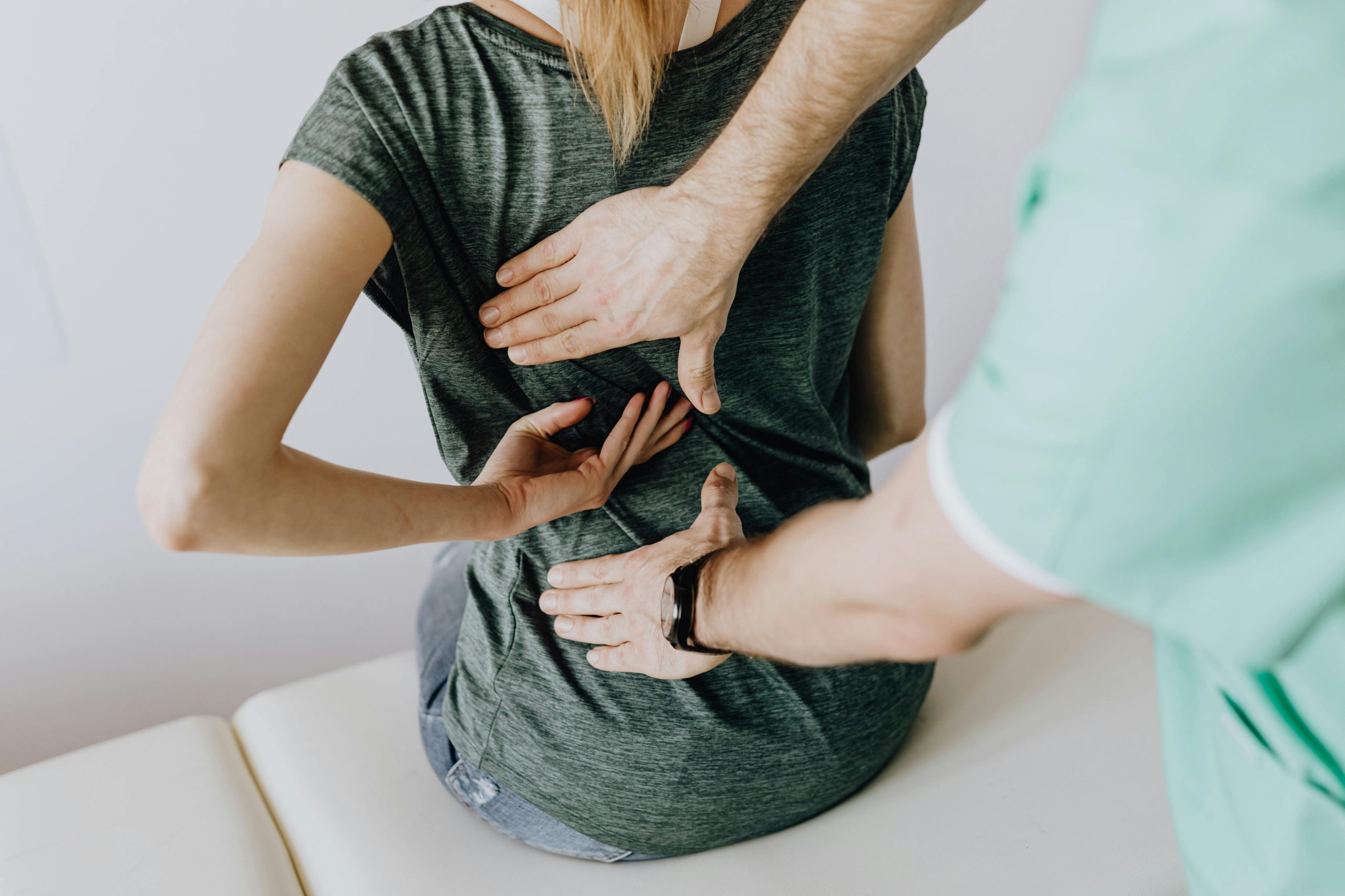 Woman with back issues at the doctors 