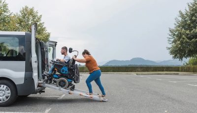 wheelchair-hero person in a wheelchair being loaded into van